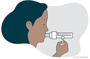 A person with a peak flow meter mouthpiece in their mouth.